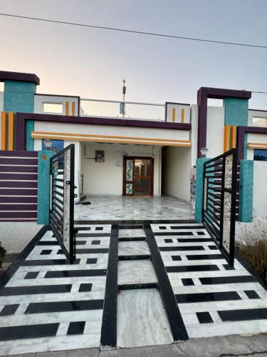 a building with a gate in front of it at Karthikeya villa’s in Narasaraopet