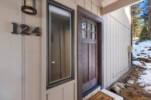 a front door of a house with snow on the ground at Fun & Air Conditioned Lake Tahoe 3 BR/2.5 BA Home in Incline Village