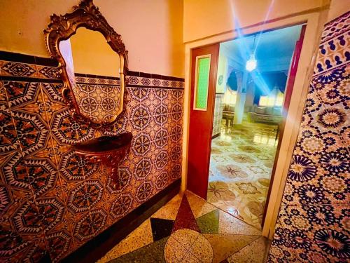 a bathroom with a sink and a mirror on the wall at Tanja tanger moroco in Tangier