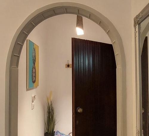 an archway leading to a door in a room at Buenavista apartment in Ýpsos