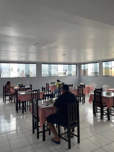 En restaurant eller et andet spisested på Hotel Pousada Acauã Acesso através de escadas