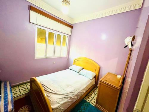 a small bedroom with a bed and a window at Welkom ketama bro in Ketama