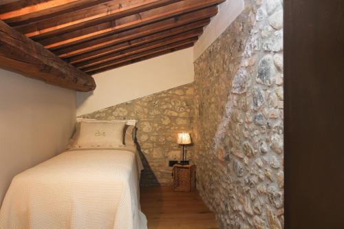 Ένα ή περισσότερα κρεβάτια σε δωμάτιο στο Agriturismo iOlive Tuscany appartamento Pendolino