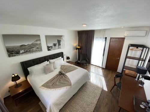 Postel nebo postele na pokoji v ubytování HOTEL MINA REAL