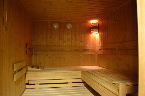 a wooden sauna with two beds in it at Hotel Brandl in Bad Wörishofen