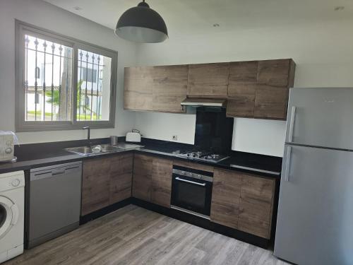 Kuchyň nebo kuchyňský kout v ubytování Maison Front de mer