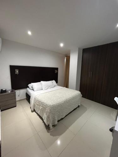 Postel nebo postele na pokoji v ubytování Hotel Sun Suite