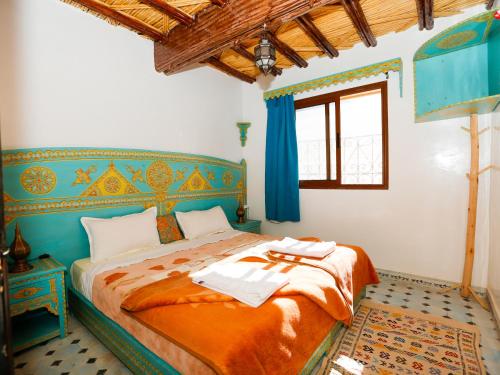 Postel nebo postele na pokoji v ubytování Kasbah Du Roches Armed