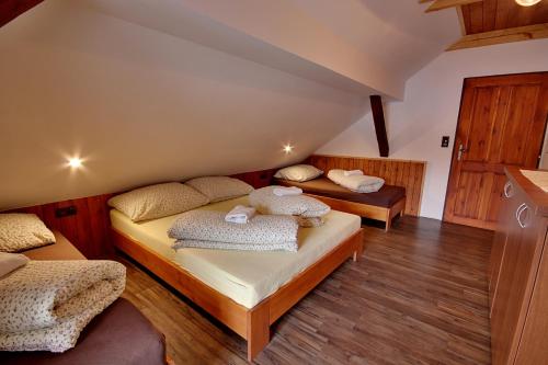 a room with two beds in a attic at Chalupa Chlum Míša in Volary