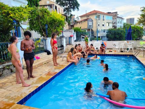 a group of people in a swimming pool at Rio World Connection Hostel in Rio de Janeiro
