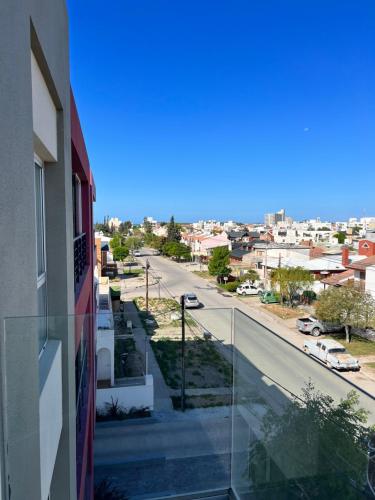 a view of a city street from a building at BRISApartament a cuadras del mar, moderno y confortable in Puerto Madryn