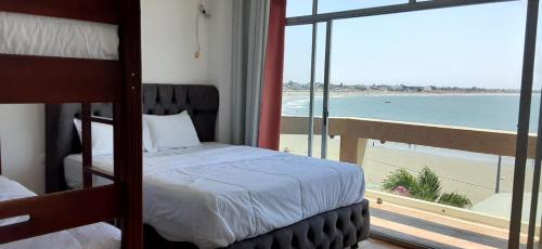 Postel nebo postele na pokoji v ubytování Hotel Paradise Beach