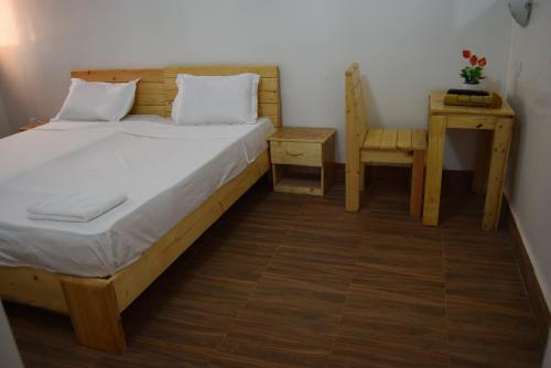 Giường trong phòng chung tại Les Berges du Sine