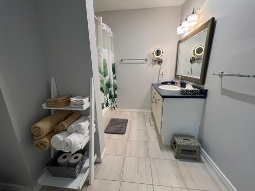 a bathroom with a sink and a mirror at Cozy Arbour Vacation Home - 8 beds 5 rooms in Kingston