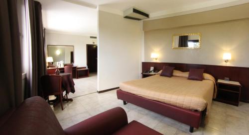 Postel nebo postele na pokoji v ubytování Hotel Forum