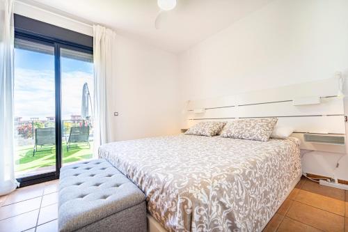a bedroom with a bed and a large window at Sunshine in Lajares