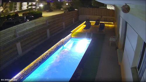 an overhead view of a swimming pool at night at Casa Do Cairo-Sharm Alsheikh in Sharm El Sheikh