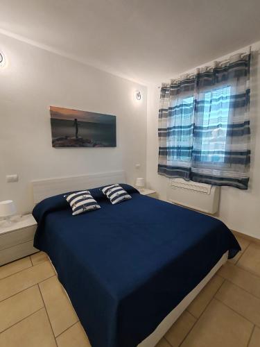 Ένα ή περισσότερα κρεβάτια σε δωμάτιο στο ONDINA APARTMENT IN VERSILIA