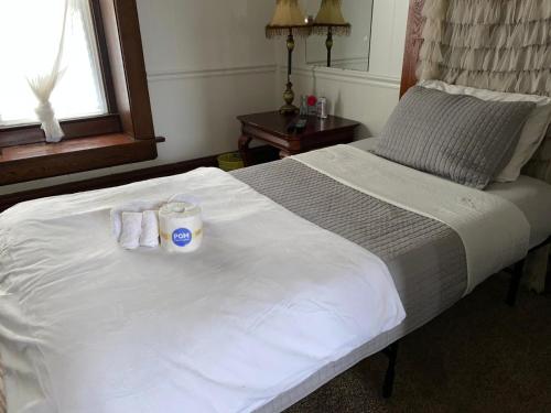 a hotel room with a bed with towels on it at Hite Home in Akron
