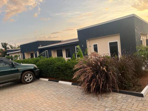 a car parked in front of a house at Eliora Hotel, Tororo in Tororo