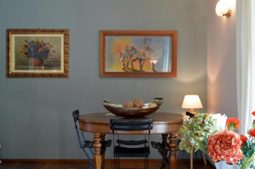 a room with a table with a bowl of fruit on it at B&B La Casa di Angela in Cusago