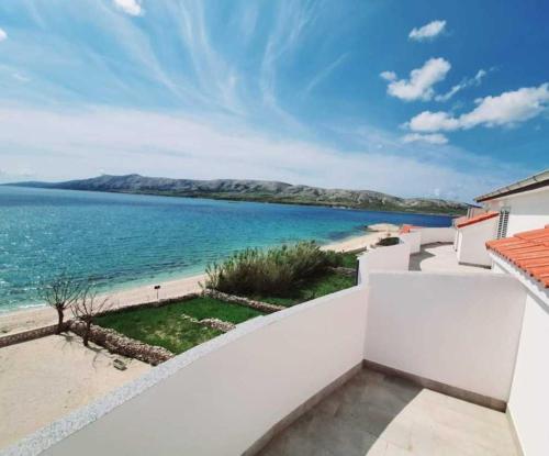 a view of the ocean from the balcony of a house at AtlantisPagNovalja in Zubovići