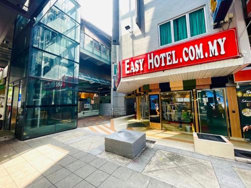 a building with a sign that reads easy hotelcolmcolm my at ESSY Hotel KL Sentral in Kuala Lumpur