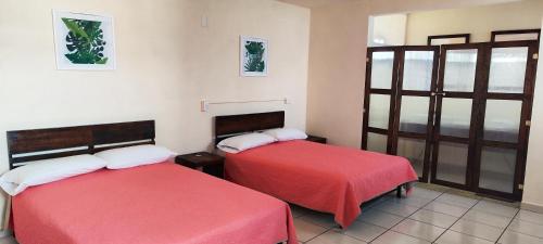 Postel nebo postele na pokoji v ubytování Hotel Maeva