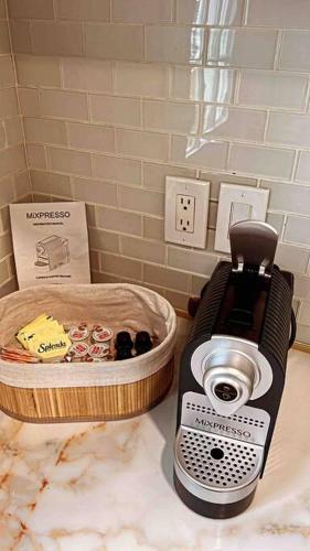 a blender sitting on top of a counter at Charming 3BR, 1BA Near Heart of Boston! in Watertown