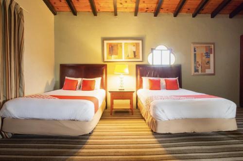 Cama ou camas em um quarto em Hacienda Corteza