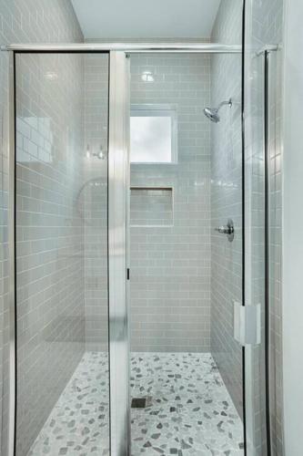 a shower with a glass door in a bathroom at Lake Hm Hill Mountain View-BOAT Rental Available! in Canyon Lake