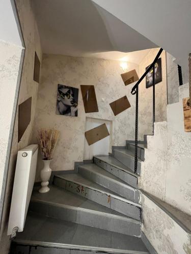 a staircase in a house with a vase on it at Hotel G&G in Tbilisi City