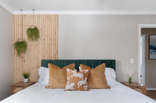 a bedroom with a white bed with pillows at Game Room+Hot Tub+Pool+King Beds+More in Gansevoort