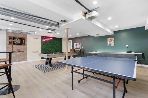 a ping pong room with a ping pong table at Game Room+Hot Tub+Pool+King Beds+More in Gansevoort