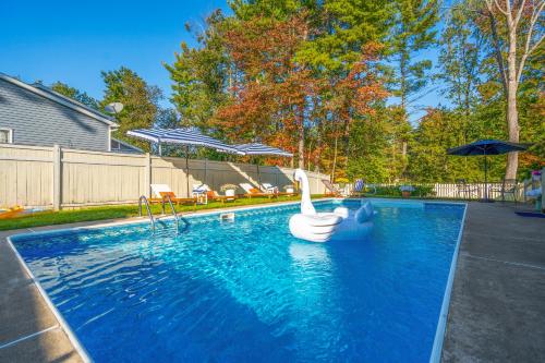 a swimming pool with an inflatable duck in the water at Game Room+Hot Tub+Pool+King Beds+More in Gansevoort