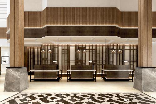 タンゲランにあるバンダラ インターナショナル ホテル マネージド バイ アコーホテルズの建物内のダイニングルーム(テーブル、椅子付)