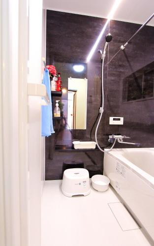a bathroom with a toilet and a sink at 薫樹xiang po po inn in Kyoto
