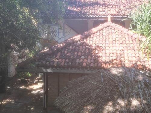 a roof of a house with a straw roof at Villa Wonne 1 Floor Family Appartement! in Arugam Bay