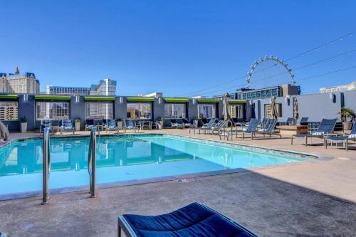 a large swimming pool on the roof of a building at Diligence at The Platinum - NO Resort Fees and Free Parking in Las Vegas