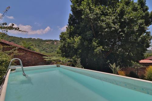 The swimming pool at or close to Sleep Haven Self-Catering Accommodation - Nelspruit