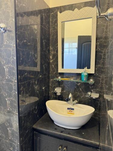 a bathroom with a sink and a mirror at Superior Villa in Mirpur city Azad kashmir 