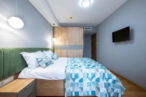 Postel nebo postele na pokoji v ubytování Metekhi Boutique Hotel