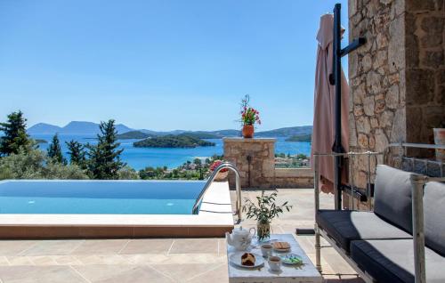 a villa with a pool and a view at Villa Kallisto in Nydri