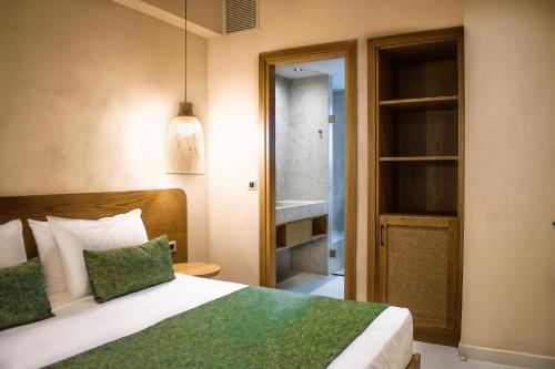 a bedroom with a bed and a walk in closet at Panorama Hotel in Falasarna