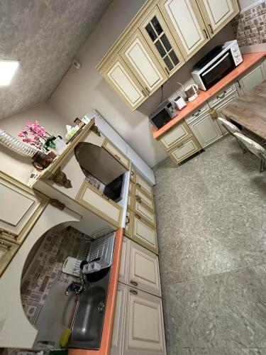 an overhead view of an empty kitchen with a sink at Popock City Center in Yerevan