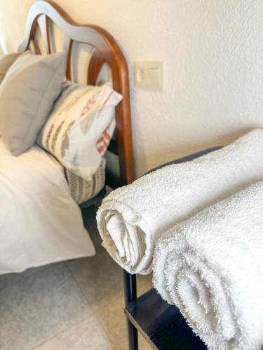 a close up of a bed with a white blanket at Camping Gran Sol in Montferrer