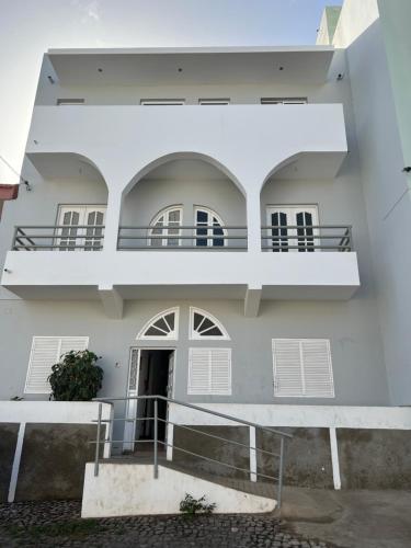 an external view of a building with balconies at Brand new apartment in Mindelo in Mindelo