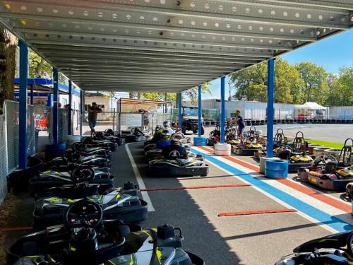 a group of people riding in bumper cars at a race at Le Château de Leugny in Oiron
