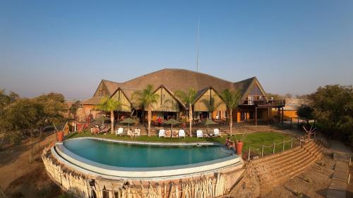an aerial view of a resort with a swimming pool at Opuwo Country Lodge Campsite in Opuwo