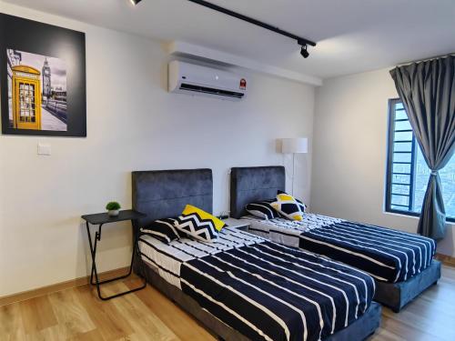 Ένα ή περισσότερα κρεβάτια σε δωμάτιο στο Arte Cheras Duplex Suites